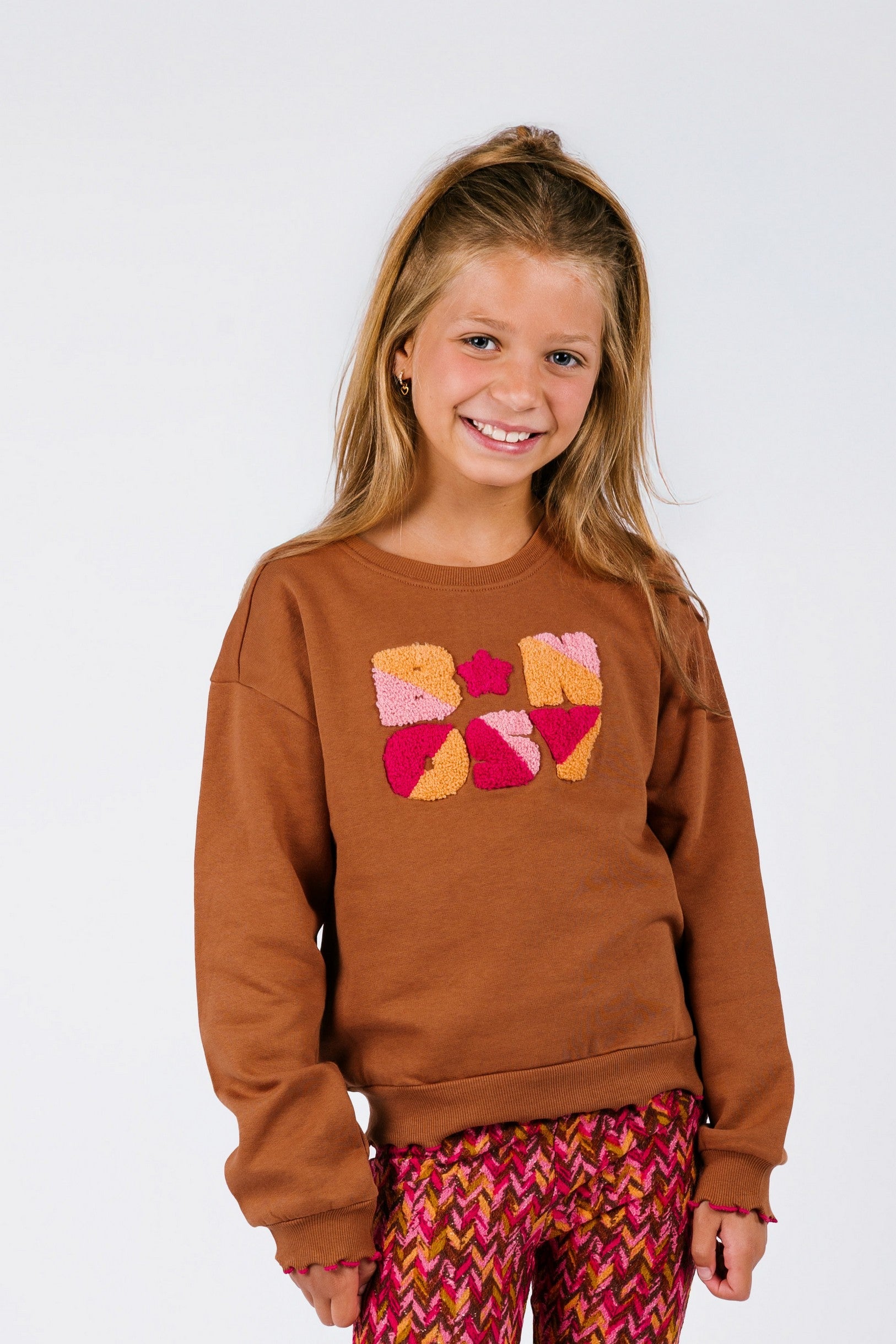 B.Nosy Sue Sweater Bruin