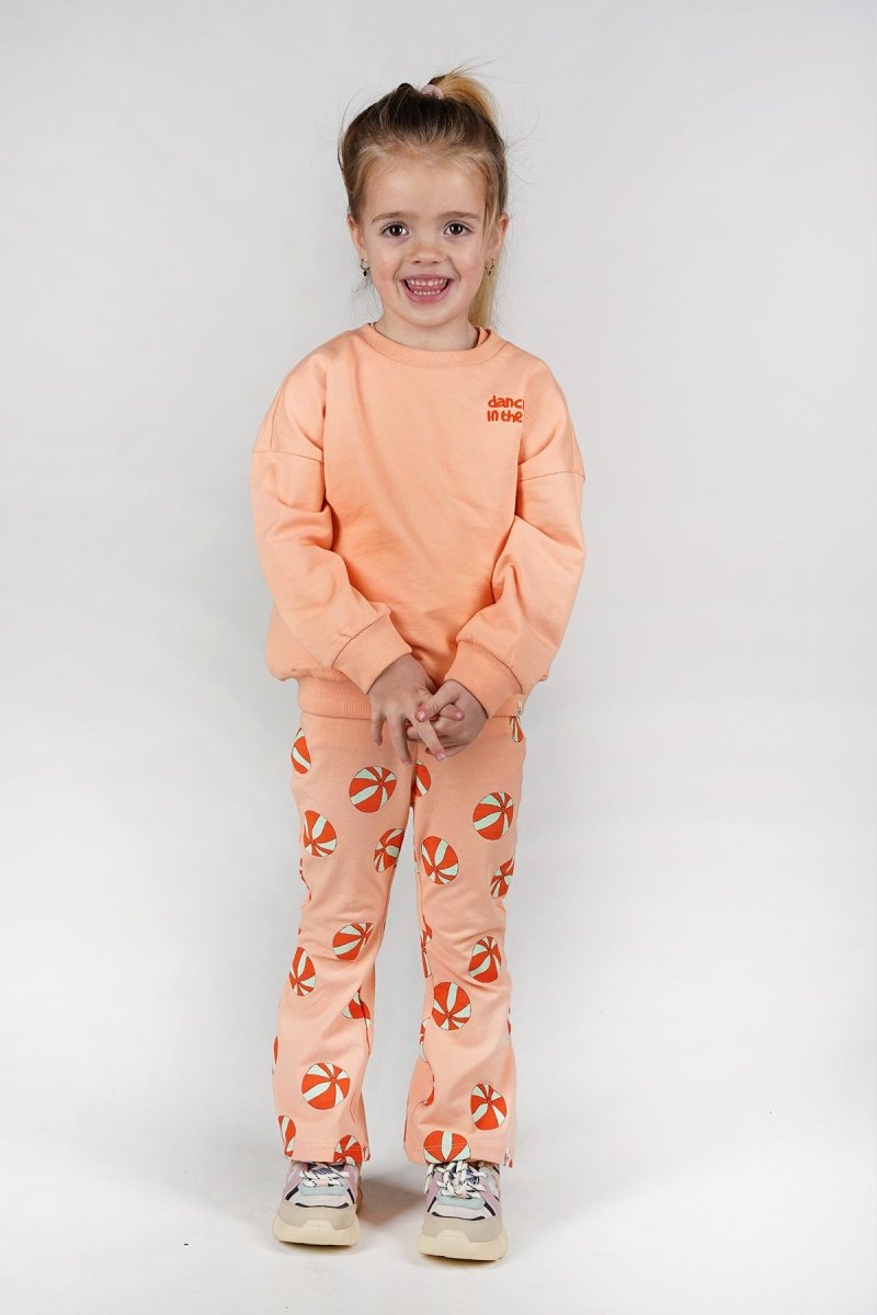 Nena flared broek oranje beachbal Dancing - The New Chapter Store