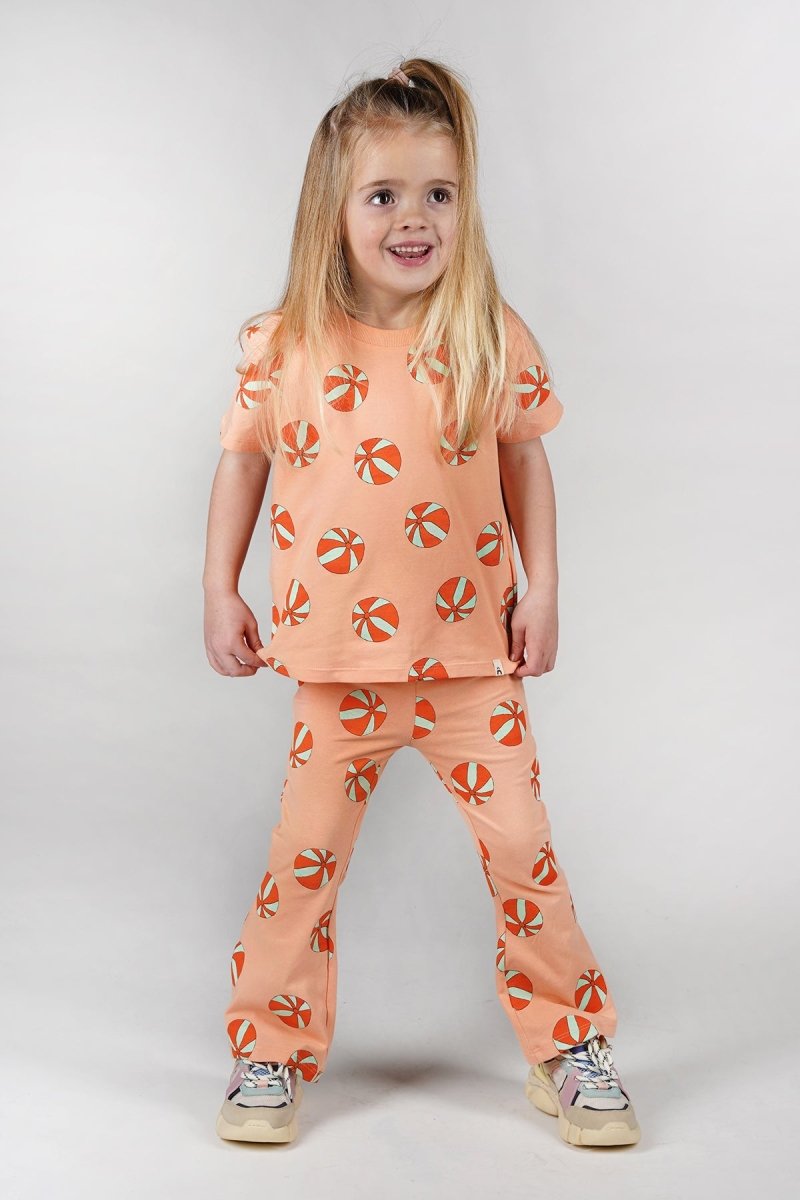 Nena flared broek oranje beachbal Dancing - The New Chapter Store